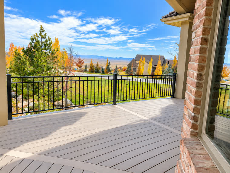 Bountiful deck with black metal railing looking out over the valley