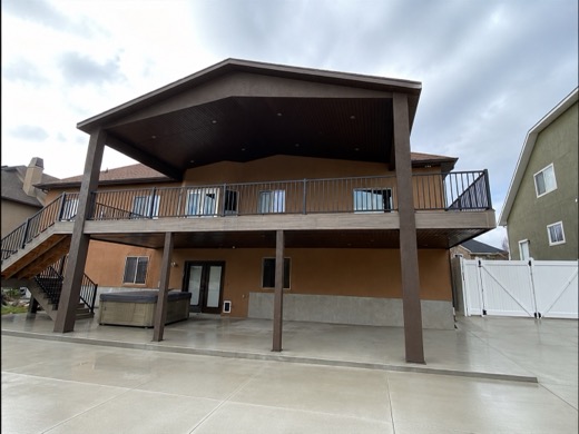 Custom brown roof over a two-story deck and patio