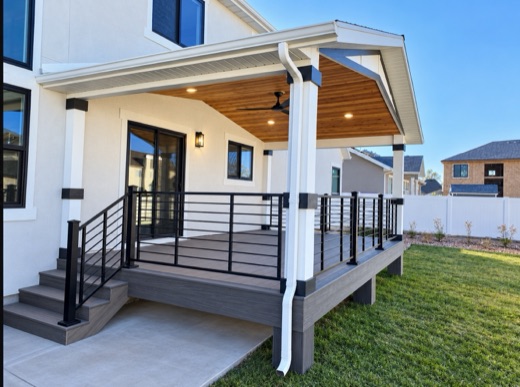 Custom gable roof with a tongue-and-groove wood ceiling over a composite deck