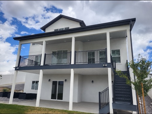 Custom roof over a two-story covered deck and patio