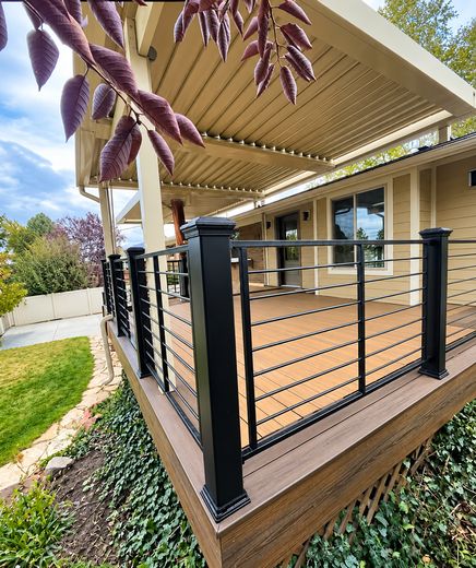 Black MetalWorks horizontal-rod railing on a covered composite deck