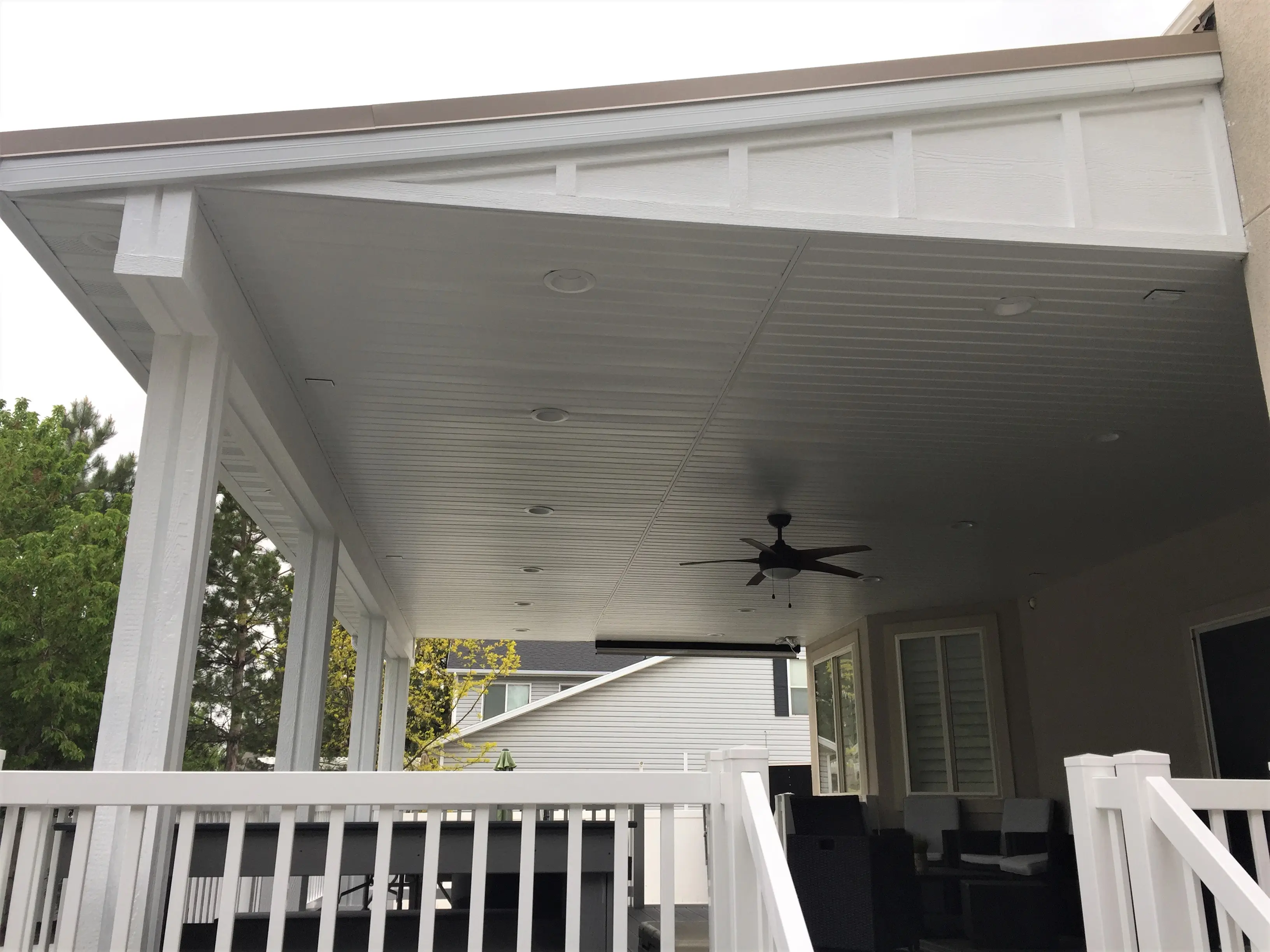 Custom Sloped Roof Transform an outdoor space with custom outdoor deck roofing! We specialize in providing a seamless blend between the house and new structure. This is a custom sloped roof.