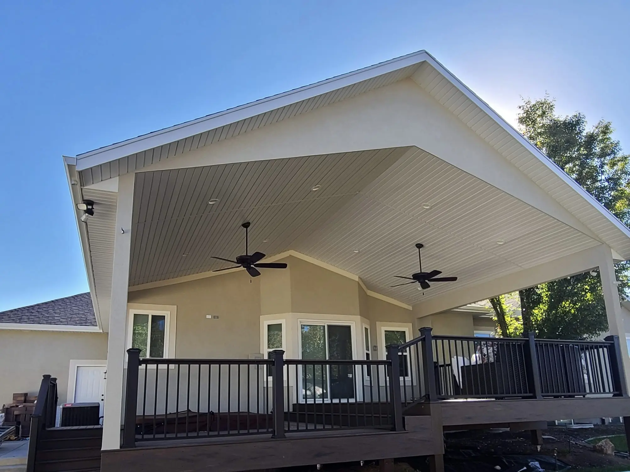 Custom vaulted roof 89 Transform an outdoor space with custom outdoor deck roofing! We specialize in providing a seamless blend between the house and new structure. This is a custom vaulted roof.