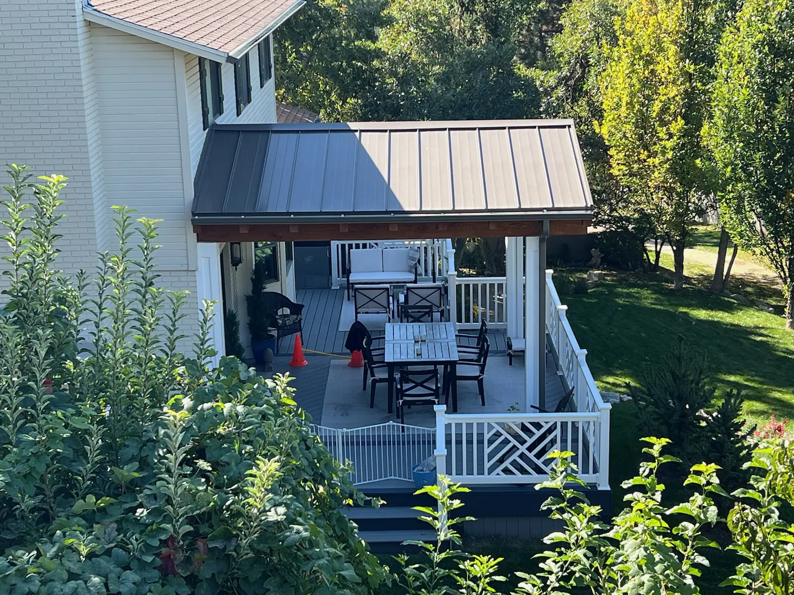 Metal Roof Transform an outdoor space with custom outdoor deck roofing! We specialize in providing a seamless blend between the house and new structure. This is a metal roof.