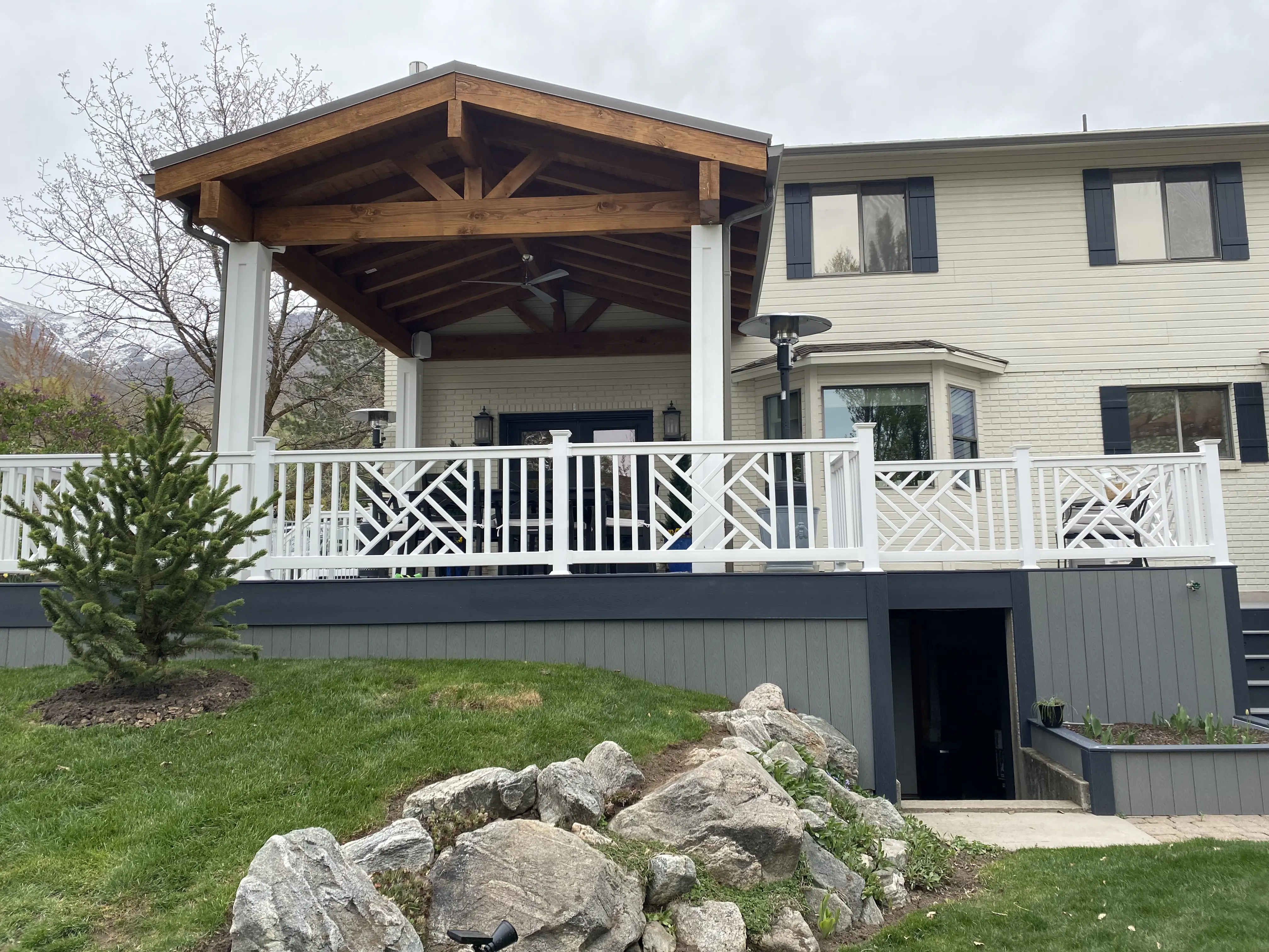 custom timber roof Transform an outdoor space with custom outdoor deck roofing! We specialize in providing a seamless blend between the house and new structure. This is a custom timber roof.