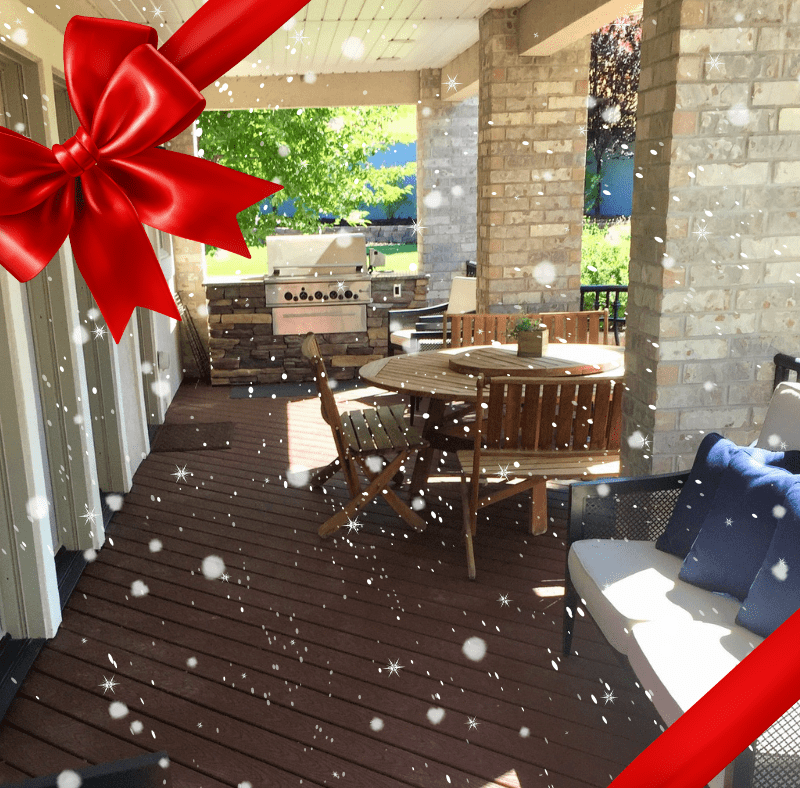 composite deck with furniture that is decorate to look like a christmas present