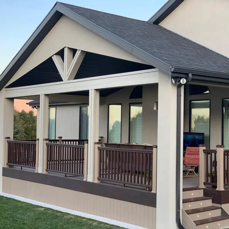 composite deck featuring a custom deck roof and railings