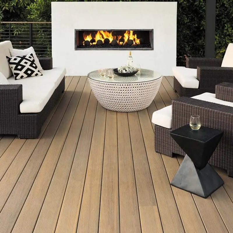 Timbertech composite deck with railing, fireplace and outdoor furniture