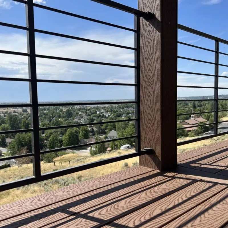 Horizontal steek deck railing featuring the Utah skyline