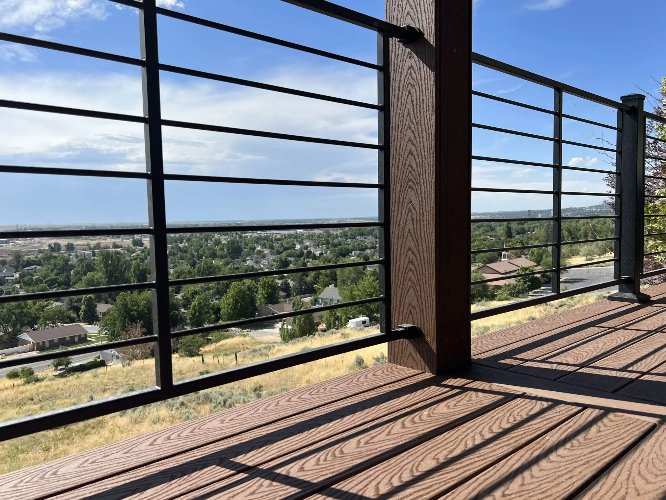 Horizontal steek deck railing featuring the Utah skyline