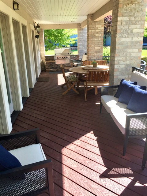 Lower level composite deck with outdoor seating area and grill