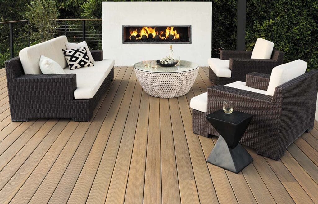 Timbertech composite deck with railing, fireplace and outdoor furniture