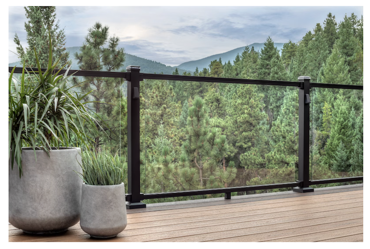 Trex Signature Aluminum deck railing featuring a clear glass inlay that showcases the mountain skyline. 
